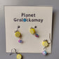 Multiple Lemon Drop Earrings on a Planet Gralockamay card backing.