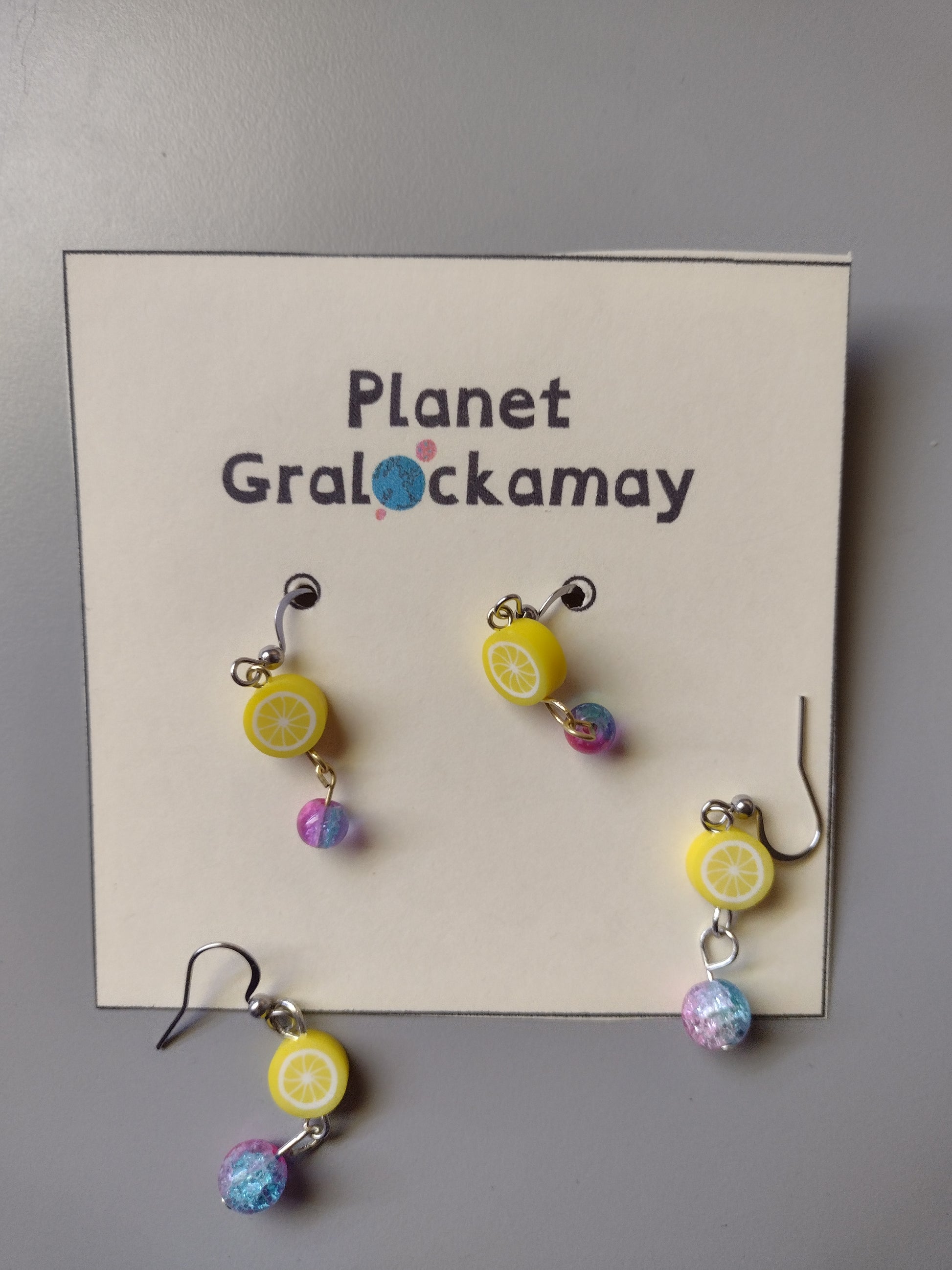 Multiple Lemon Drop Earrings on a Planet Gralockamay card backing.