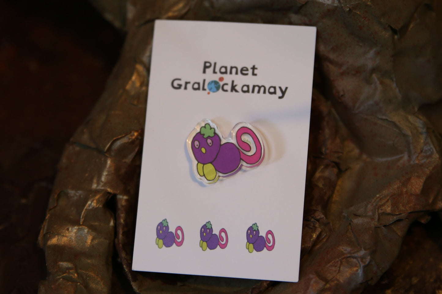 Purple Gralockamay Pin on card.